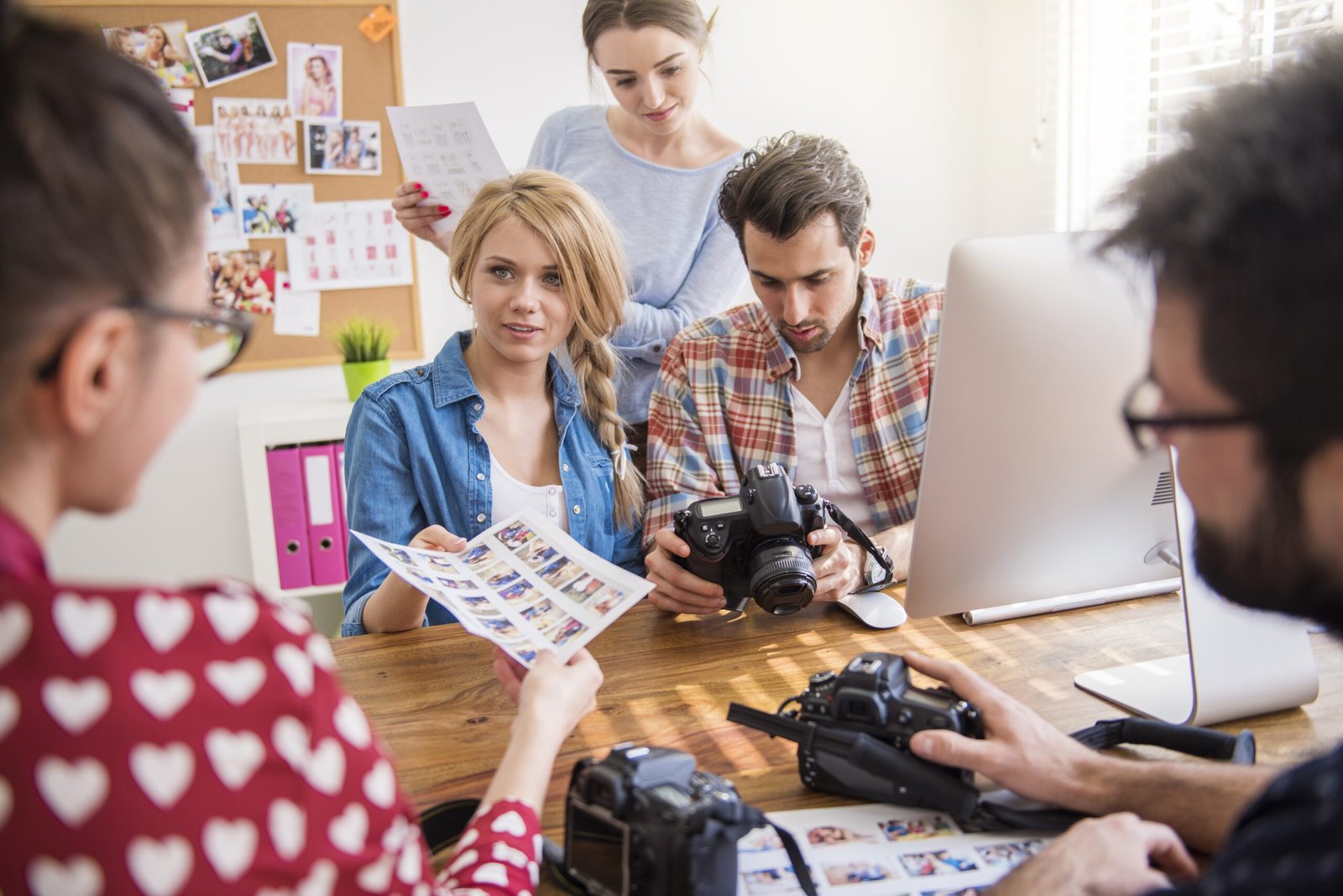Professional photographers working in their office